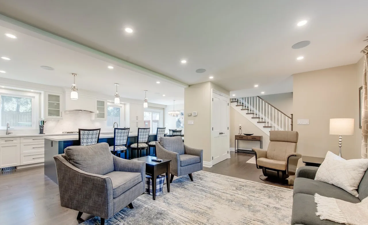 Recessed lighting in a living room and kitchen from the Current Power Solutions project gallery